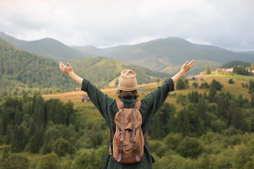 young-female-traveler-enjoying-rural-surroundings-1024x683
